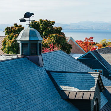 View of roofs and Lake Champlain in the distance